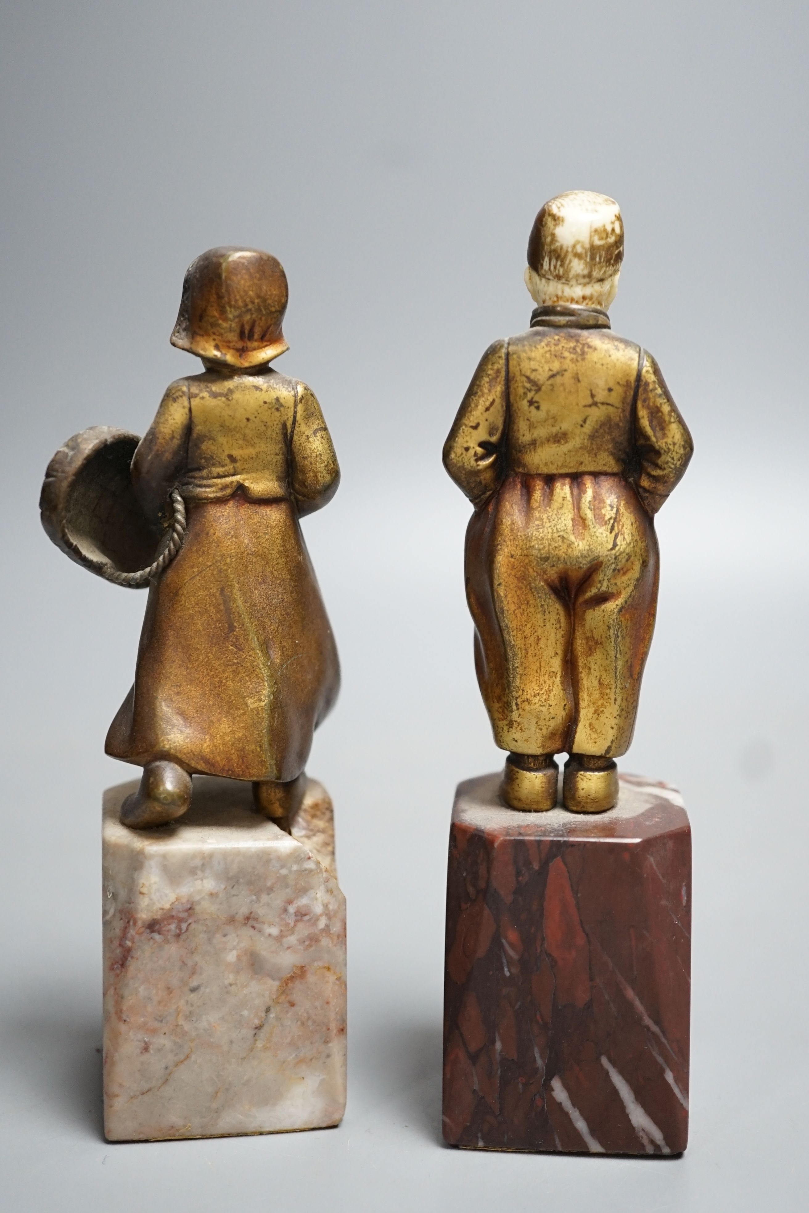 Two Art Deco gilt bronze and ivory Dutch youths, on marble plinths (one a.f) 15cm